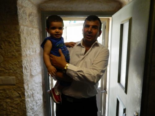 Our staff member Adnan with his toddler