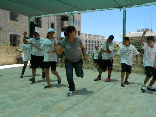 Wi'am kids shake a leg on the first day of camp.