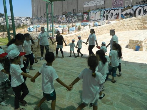 Children held hands and danced in a circle.