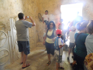 Kids and volunteers cram into the small, ancient jail.